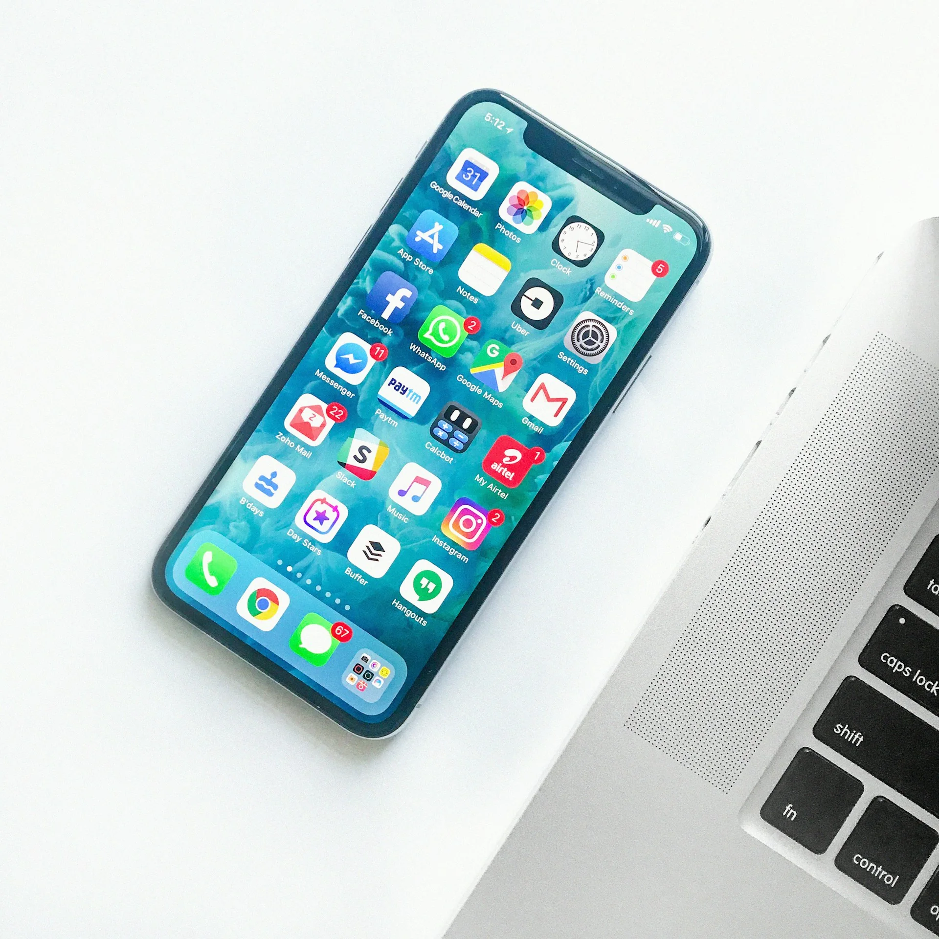 White smartphone presented on a clean minimal surface